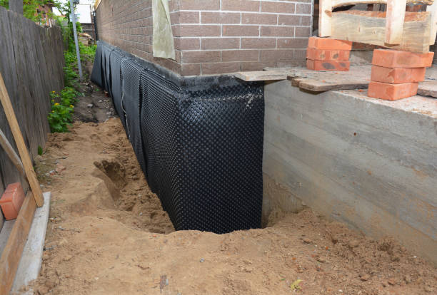SJ Waterproofing Pros technician performing targeted Waterproofing assessment in Monticello, KY